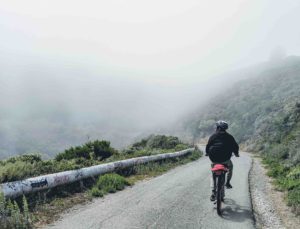 Man Coasts Downhill On Bike