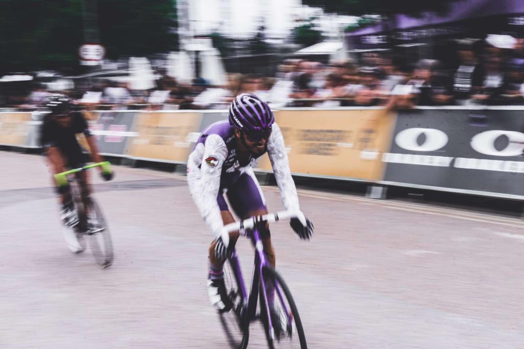 Ebike Helmet: Man bikes with purple helmet on